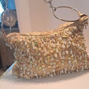 Gold Shoulder Bag with Shimmering Sequins and Metallic Handle